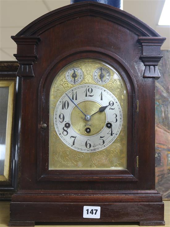 An Edwardian walnut mantel clock